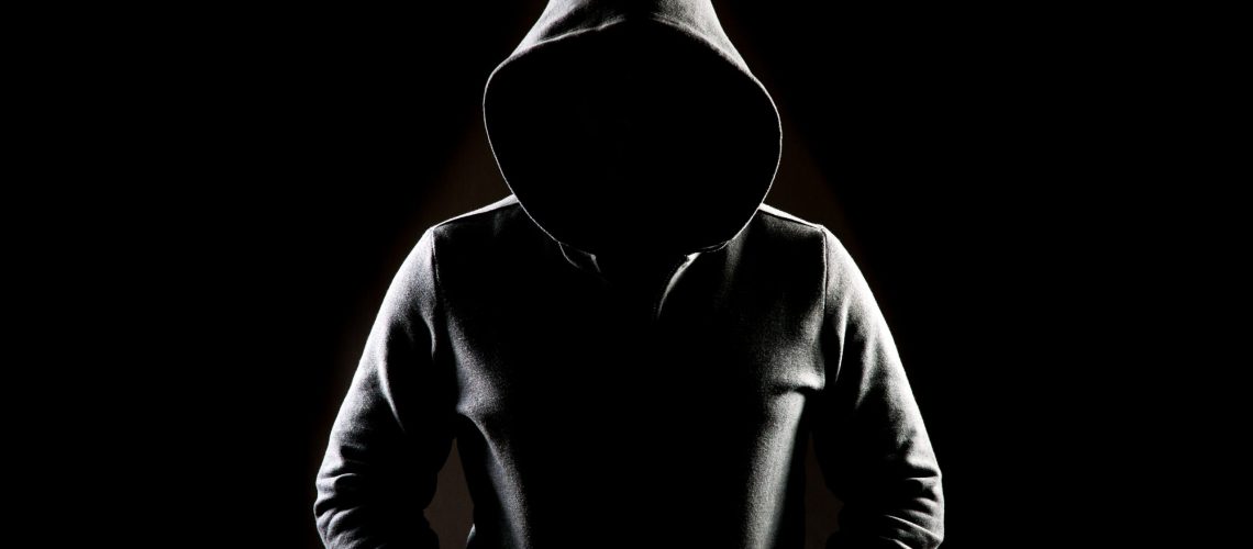 Mysterious,Man,Wit,Hoodie,In,Silhouette,Isolated,On,Black,Background